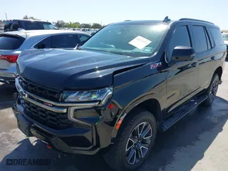 2021 Chevrolet Tahoe Z71 with VIN 1GNSKPKD2MR124128, listed as a IAAI auction lot 41874524 with 75,066 mi miles. Bid and sale history available at carsss.com. Image 2.