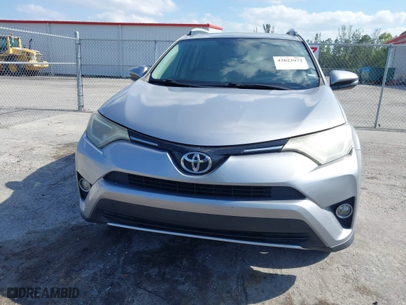 2016 Toyota RAV4 XLE with VIN 2T3WFREV7GW280362, listed as a IAAI auction lot 42023972 with 160,651 mi miles. Bid and sale history available at carsss.com. Image 13.