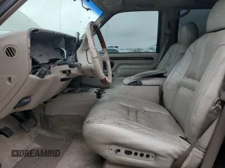 1999 Cadillac Escalade z VIN 1GYEK13R5XR415895, wystawiony jako Copart lot #87112044 z przebiegiem 141 662 mil mil oraz Tytuł czysty. Historia ofert i sprzedaży dostępna na DreamBid. Obrazek 7.
