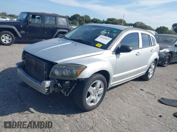 2009 Dodge Caliber SXT with VIN 1B3HB48A39D142674, listed as a IAAI auction lot 41642867 with 156,504 mi miles and . Bid and sale history available at carsss.com. Image 2.