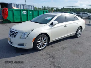 2013 Cadillac XTS Premium z VIN 2G61S5S35D9103948, wystawiony jako IAAI lot #42090444 z przebiegiem 154 728 mil mil oraz . Historia ofert i sprzedaży dostępna na DreamBid. Obrazek 2.