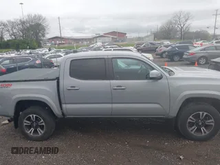 2019 Toyota Tacoma SR z VIN 3TMCZ5AN1KM206969, wystawiony jako IAAI lot #41951159 z przebiegiem 94 875 mil mil oraz . Historia ofert i sprzedaży dostępna na DreamBid. Obrazek 13.