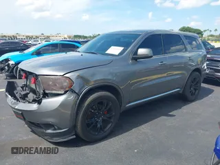 2013 Dodge Durango SXT with VIN 1C4RDHAGXDC500144, listed as a IAAI auction lot 42693122 with 194,519 mi miles and . Bid and sale history available at DreamBid. Image 17.