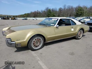 1967 Oldsmobile Toronado with VIN 396877M621130, listed as a Copart auction lot 71016094 with 17,887 mi miles and Salvage Title. Bid and sale history available at DreamBid. Image 1.