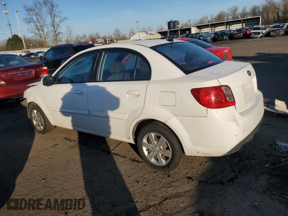 2010 Kia Rio LX with VIN KNADH4A35A6691869, listed as a Copart auction lot 42025785 with 126,381 mi miles and Salvage Title. Bid and sale history available at carsss.com. Image 2.