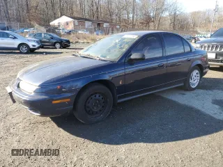 1999 Saturn SL with VIN 1G8ZK5270XZ184042, listed as a Copart auction lot 86827254 with 0 mi miles and Salvage Title. Bid and sale history available at carsss.com. Image 1.