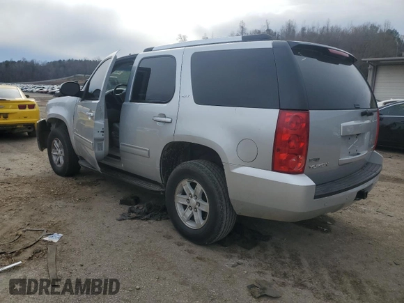 2012 GMC Yukon SLT with VIN 1GKS1CE08CR203822, listed as a Copart auction lot 82955253 with 122,508 mi miles and Salvage Title. Bid and sale history available at carsss.com. Image 2.