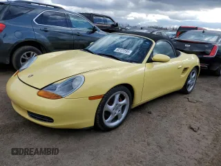1999 Porsche Boxster z VIN WP0CA2985XU632719, wystawiony jako Copart lot #52127295 z przebiegiem 72 485 mil mil oraz Szkoda całkowita • Salvage title. Historia ofert i sprzedaży dostępna na DreamBid. Obrazek 1.