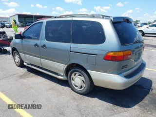 1999 Toyota Sienna LE z VIN 4T3ZF13C4XU118561, wystawiony jako IAAI lot #42536325 z przebiegiem 273 336 mil mil oraz . Historia ofert i sprzedaży dostępna na DreamBid. Obrazek 3.