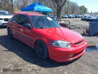 1997 Honda Civic DX with VIN 2HGEJ6449VH104445, listed as a IAAI auction lot 41886646 with 216,780 mi miles. Bid and sale history available at carsss.com. Image 1.