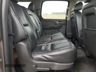 2013 Chevrolet Suburban LT with VIN 1GNSKJE77DR131188, listed as a Copart auction lot 52880375 with 147,278 mi miles and Salvage Title. Bid and sale history available at DreamBid. Image 11.