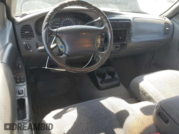 1999 Ford Ranger XLT with VIN 1FTZR15X8XTB13048, listed as a Copart auction lot 53948805 with 154,436 mi miles and Salvage title. Bid and sale history available at DreamBid. Image 8.
