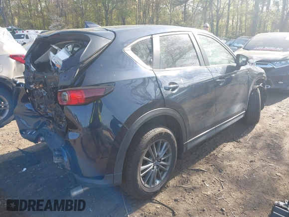 2019 Mazda CX-5 Touring with VIN JM3KFBCM6K0513037, listed as a IAAI auction lot 42121789 with 59,455 mi miles and . Bid and sale history available at DreamBid. Image 4.