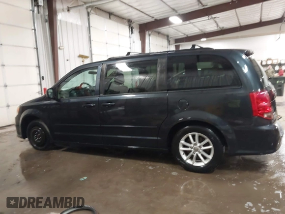 2014 Dodge Grand Caravan SXT with VIN 2C4RDGCGXER154709, listed as a IAAI auction lot 41117603 with 214,872 mi miles and . Bid and sale history available at DreamBid. Image 14.