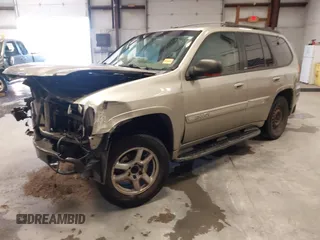 2003 GMC Envoy SLT z VIN 1GKDS13S932299354, wystawiony jako IAAI lot #41238557 z przebiegiem 251 535 mil mil oraz . Historia ofert i sprzedaży dostępna na DreamBid. Obrazek 2.