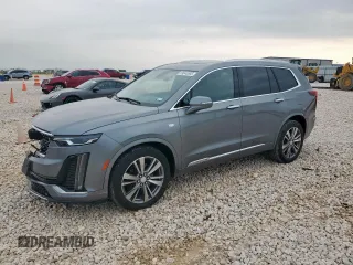 2022 Cadillac XT6 Premium Luxury z VIN 1GYKPCRS9NZ111220, wystawiony jako Copart lot #59040885 z przebiegiem 64 818 mil mil oraz Szkoda całkowita • Salvage title. Historia ofert i sprzedaży dostępna na DreamBid. Obrazek 1.