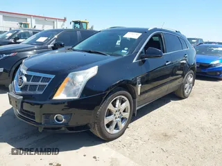 2011 Cadillac SRX Premium Collection z VIN 3GYFNCEY5BS597566, wystawiony jako IAAI lot #41983784 z przebiegiem 102 989 mil mil oraz . Historia ofert i sprzedaży dostępna na DreamBid. Obrazek 2.