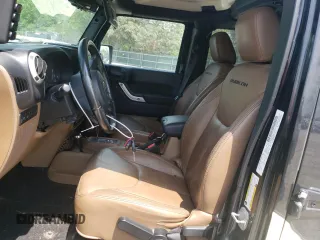 2014 Jeep Wrangler Unlimited Rubicon with VIN 1C4BJWFGXEL291187, listed as a Copart auction lot 54897675 with 227,478 mi miles and Salvage title. Bid and sale history available at DreamBid. Image 7.