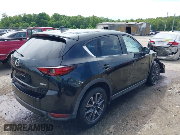 2018 Mazda CX-5 Grand Touring z VIN JM3KFBDM5J0307785, wystawiony jako IAAI lot #42302609 z przebiegiem 81 974 mil mil oraz . Historia ofert i sprzedaży dostępna na DreamBid. Obrazek 4.