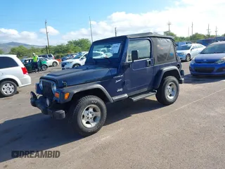 2002 Jeep Wrangler Sport z VIN 1J4FA49SX2P760671, wystawiony jako IAAI lot #41861841 z przebiegiem 125 728 mil mil oraz . Historia ofert i sprzedaży dostępna na DreamBid. Obrazek 2.