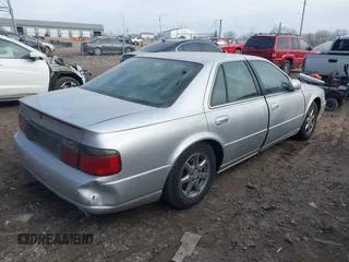 2002 Cadillac Seville Touring STS z VIN 1G6KY54902U102873, wystawiony jako IAAI lot #39710788 z przebiegiem 120 116 mil mil oraz . Historia ofert i sprzedaży dostępna na DreamBid. Obrazek 4.