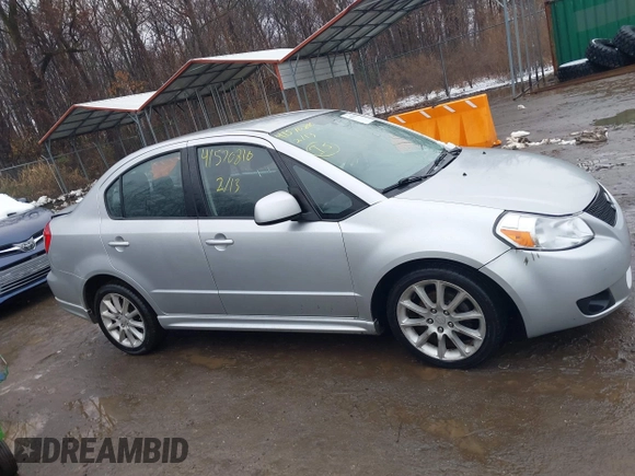 2011 Suzuki SX4 z VIN JS2YC5A41B6300385, wystawiony jako IAAI lot #41570810 z przebiegiem 117 847 mil mil oraz . Historia ofert i sprzedaży dostępna na DreamBid. Obrazek 13.