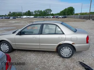 2001 Mazda Protege LX z VIN JM1BJ226210439446, wystawiony jako IAAI lot #42336976 z przebiegiem 155 990 mil mil oraz . Historia ofert i sprzedaży dostępna na DreamBid. Obrazek 15.