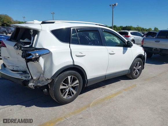 2016 Toyota RAV4 XLE with VIN JTMWFREV3GJ082487, listed as a IAAI auction lot 41833158 with 107,332 mi miles. Bid and sale history available at carsss.com. Image 4.