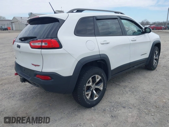 2015 Jeep Cherokee Trailhawk with VIN 1C4PJMBB7FW741365, listed as a IAAI auction lot 41879685 with 94,135 mi miles and . Bid and sale history available at carsss.com. Image 4.