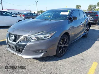 2018 Nissan Maxima SL with VIN 1N4AA6AP1JC400557, listed as a IAAI auction lot 42094626 with 96,764 mi miles and . Bid and sale history available at DreamBid. Image 2.