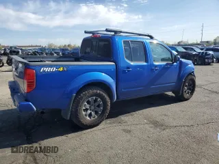 2015 Nissan Frontier Pro-4X with VIN 1N6AD0EV2FN736394, listed as a Copart auction lot 53916455 with 116,801 mi miles and Salvage title. Bid and sale history available at DreamBid. Image 3.