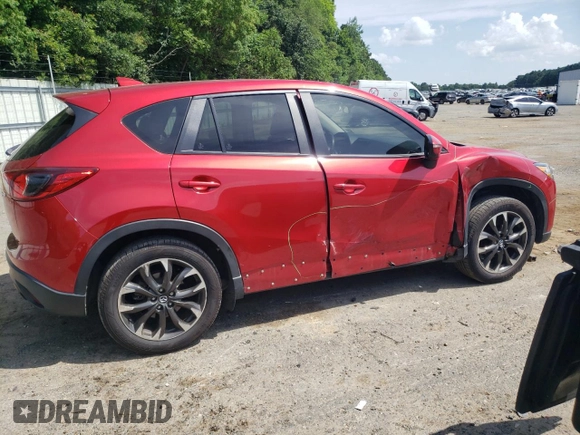 2016 Mazda CX-5 Grand Touring z VIN JM3KE2DY0G0722334, wystawiony jako Copart lot #59998185 z przebiegiem 51 449 mil mil oraz Szkoda całkowita • Salvage title. Historia ofert i sprzedaży dostępna na DreamBid. Obrazek 3.