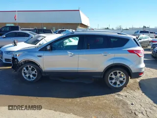2014 Ford Escape Titanium with VIN 1FMCU0JX7EUC59643, listed as a IAAI auction lot 41082952 with 143,899 mi miles. Bid and sale history available at carsss.com. Image 15.