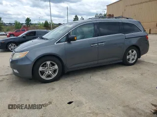 2012 Honda Odyssey Touring with VIN 5FNRL5H90CB050580, listed as a Copart auction lot 58502925 with 226,929 mi miles and Salvage title. Bid and sale history available at DreamBid. Image 1.