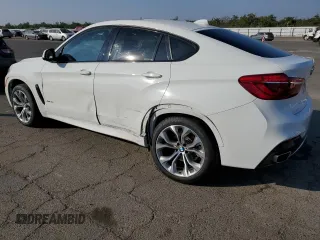 2018 BMW X6 xDrive35i with VIN 5UXKU2C52J0Z61957, listed as a Copart auction lot 73596543 with 87,119 mi miles. Bid and sale history available at carsss.com. Image 2.