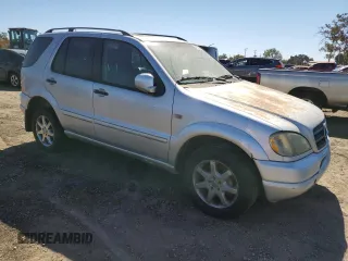2000 Mercedes-Benz M-Class with VIN 4JGAB72E5YA173269, listed as a Copart auction lot 71520714 with 239,248 mi miles and Clean Title. Bid and sale history available at carsss.com. Image 4.