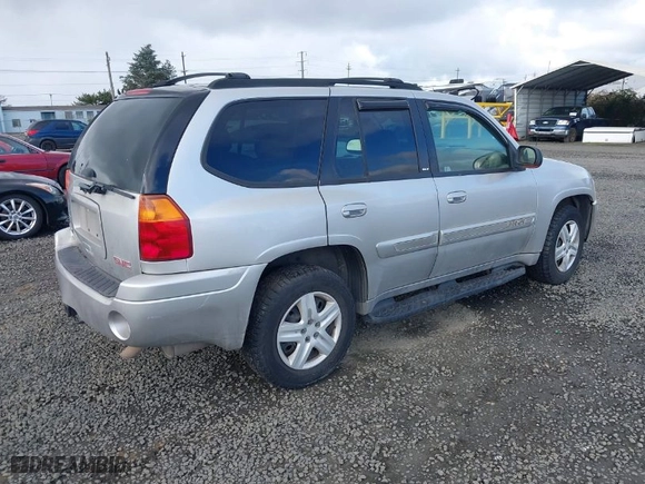 2004 GMC Envoy SLE with VIN 1GKDT13S642418153, listed as a IAAI auction lot 41660072 with 300,757 mi miles. Bid and sale history available at carsss.com. Image 4.