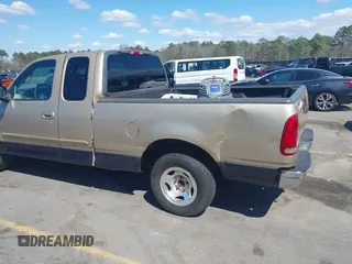2000 Ford F-150 XL z VIN 1FTRX17L8YNB02069, wystawiony jako IAAI lot #41813272 z przebiegiem 279 042 mil mil oraz . Historia ofert i sprzedaży dostępna na DreamBid. Obrazek 6.