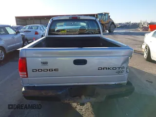 2004 Dodge Dakota Sport with VIN 1D7HG38K34S561735, listed as a IAAI auction lot 41409622 with Not Provided miles and . Bid and sale history available at carsss.com. Image 16.