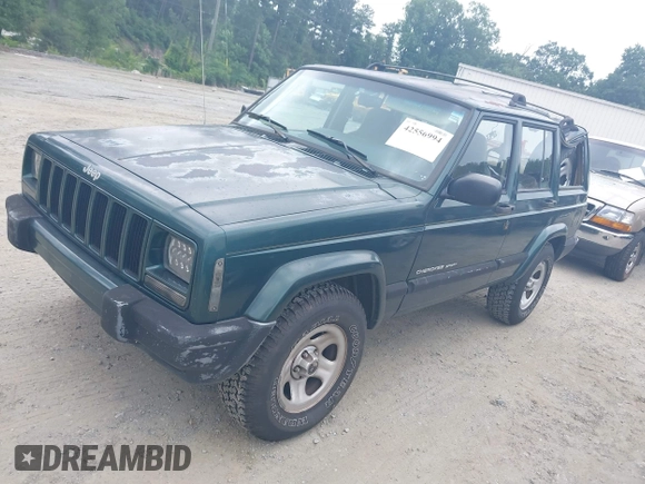 2000 Jeep Cherokee z VIN 1J4FT48S4YL265734, wystawiony jako IAAI lot #42556994 z przebiegiem 228 162 mil mil oraz . Historia ofert i sprzedaży dostępna na DreamBid. Obrazek 2.