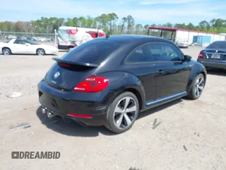 2012 Volkswagen Beetle 2.0T Turbo w/Sun/Snd/Nav PZEV with VIN 3VWVA7AT6CM659395, listed as a IAAI auction lot 41910321 with 132,114 mi miles. Bid and sale history available at carsss.com. Image 4.