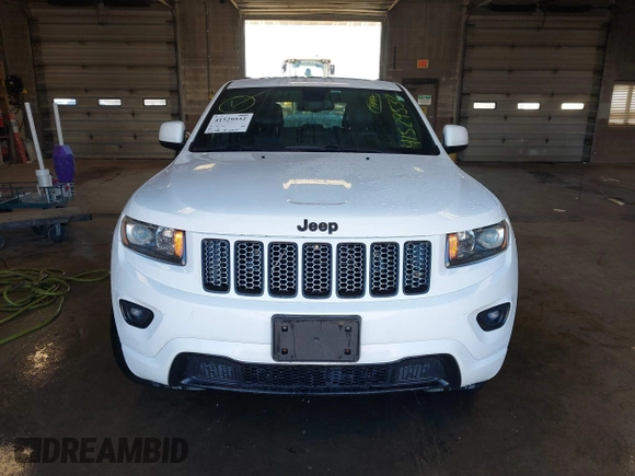2015 Jeep Grand Cherokee Laredo with VIN 1C4RJFAG4FC660665, listed as a IAAI auction lot 41529532 with 124,099 mi miles. Bid and sale history available at carsss.com. Image 12.