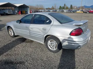 2001 Pontiac Grand Am SE1 with VIN 1G2NF52TX1M560650, listed as a IAAI auction lot 41654339 with 122,885 mi miles. Bid and sale history available at carsss.com. Image 3.