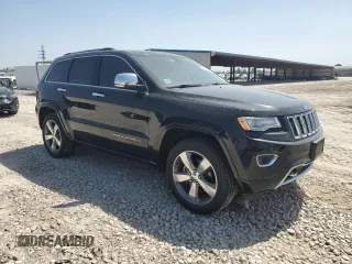 2015 Jeep Grand Cherokee High Altitude with VIN 1C4RJECGXFC906464, listed as a Copart auction lot 49657955 with 125,239 mi miles and Salvage Title. Bid and sale history available at carsss.com. Image 4.