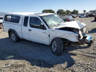 1999 Nissan Frontier XE с VIN 1N6ED26Y1XC308545, выставлен на аукционе Copart как лот 80168984 с пробегом Не указан миль и Списание • Salvage title. История ставок и продаж доступна на DreamBid. Изображение 4.