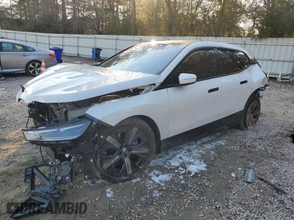 2025 BMW iX xDrive50 with VIN WB523CF0XSCS62033, listed as a Copart auction lot 42503325 with 7,294 mi miles and Salvage Title. Bid and sale history available at carsss.com. Image 1.