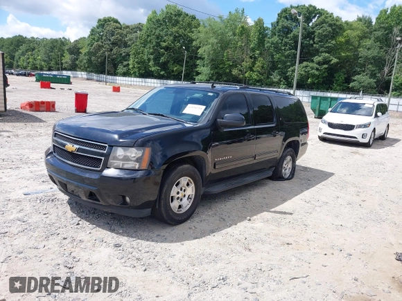 2010 Chevrolet Suburban LT z VIN 1GNUCJE08AR192831, wystawiony jako IAAI lot #42534754 z przebiegiem 165 741 mil mil oraz . Historia ofert i sprzedaży dostępna na DreamBid. Obrazek 18.