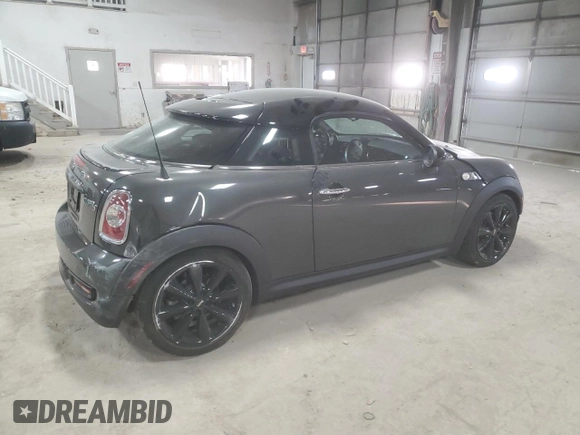 2012 MINI Coupe S z VIN WMWSX3C51CT408195, wystawiony jako Copart lot #77008744 z przebiegiem Nie podano mil oraz Szkody całkowita. Historia ofert i sprzedaży dostępna na DreamBid. Obrazek 3.