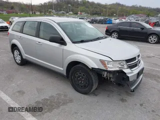2013 Dodge Journey SE with VIN 3C4PDCAB4DT729034, listed as a IAAI auction lot 41953120 with 218,189 mi miles. Bid and sale history available at carsss.com. Image 1.