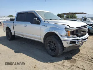 2018 Ford F-150 XL with VIN 1FTEW1CGXJFB40297, listed as a Copart auction lot 69642404 with 92,561 mi miles and Salvage title. Bid and sale history available at DreamBid. Image 4.